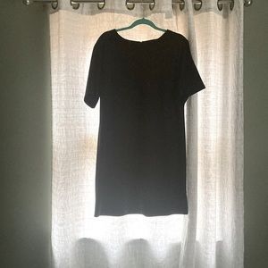 Simple back dress. Zipper in the back.  Super comfortable and easy